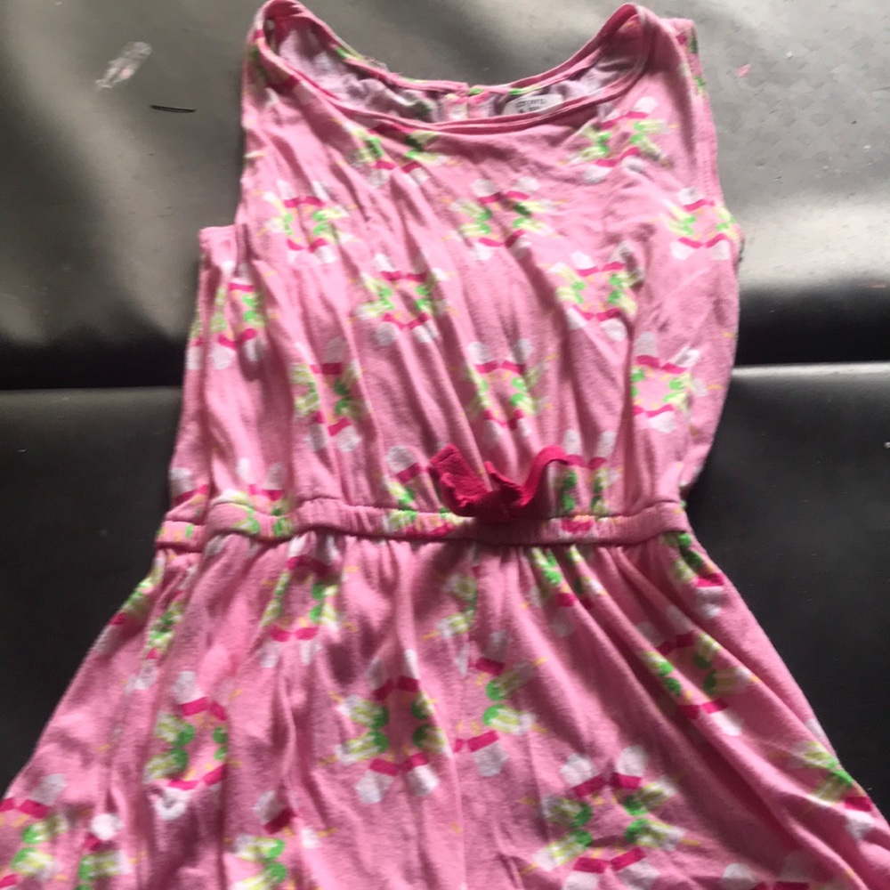 A really cute romper with popsicles on it
